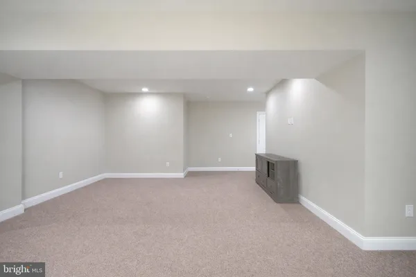 a view of a hallway with closet and a hallway