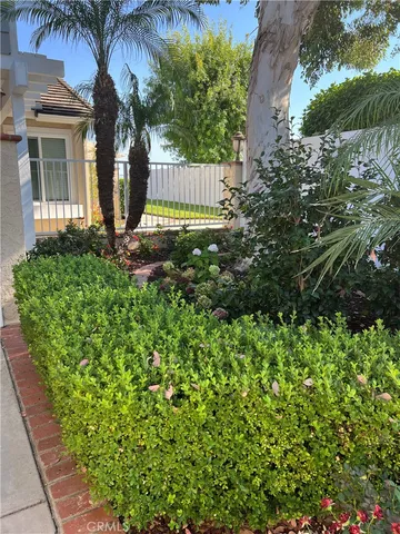 a view of a house with a flower garden