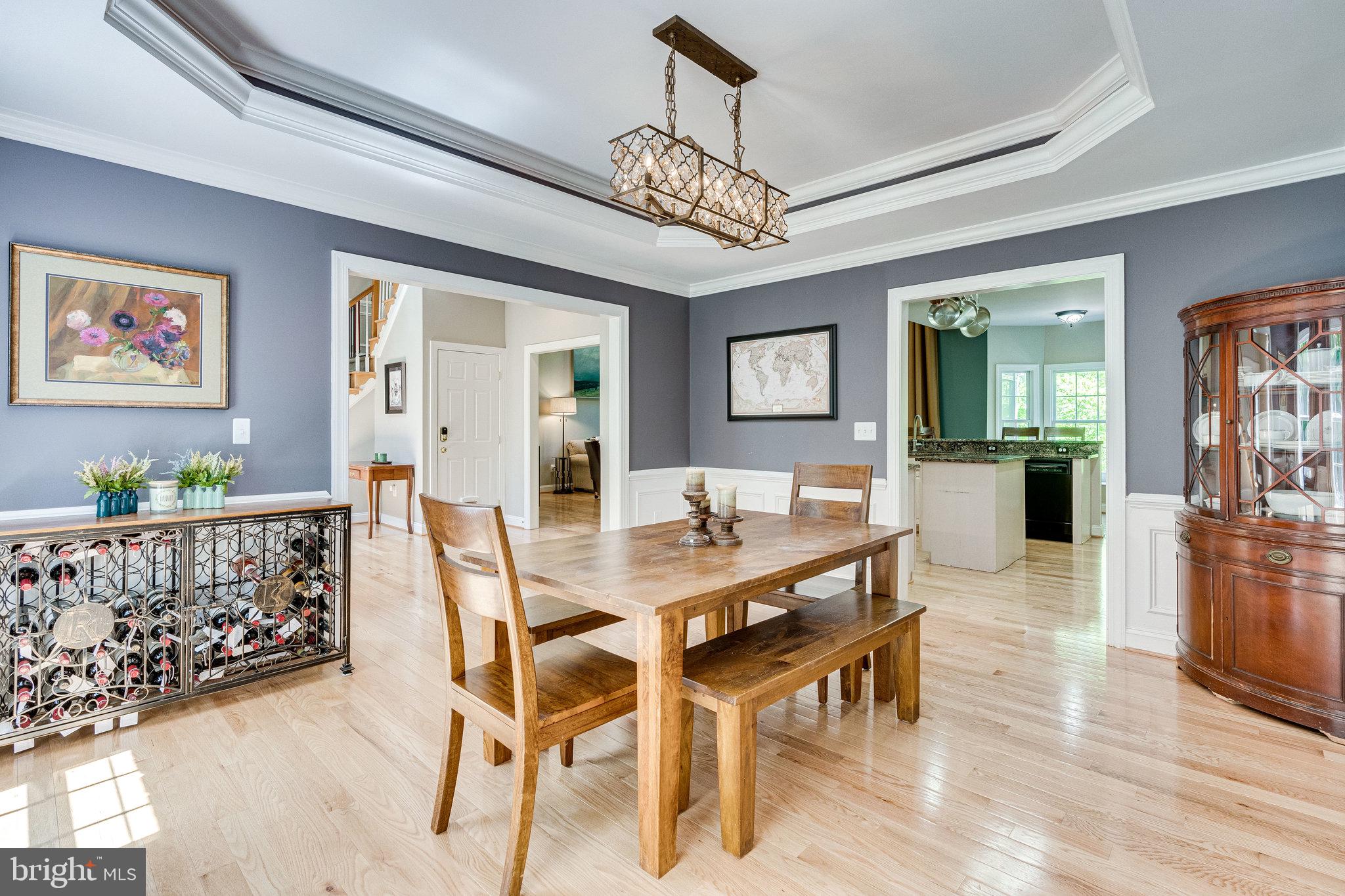 7802 Creekside View Lane Springfield, VA 22153 - Photo 13 of 107 a view of a dining room with furniture and wooden floor