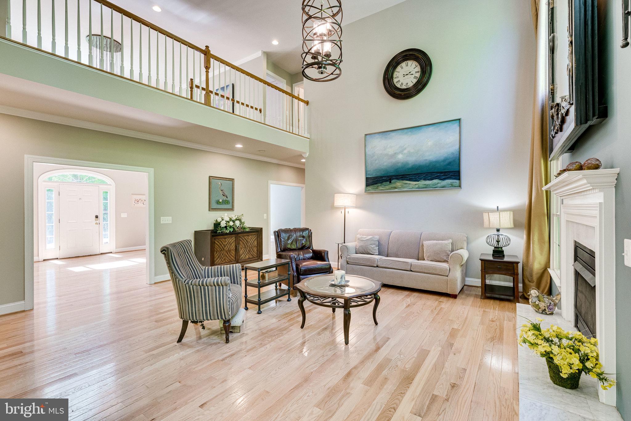 7802 Creekside View Lane Springfield, VA 22153 - Photo 28 of 107 a living room with furniture a flat screen tv and a fireplace