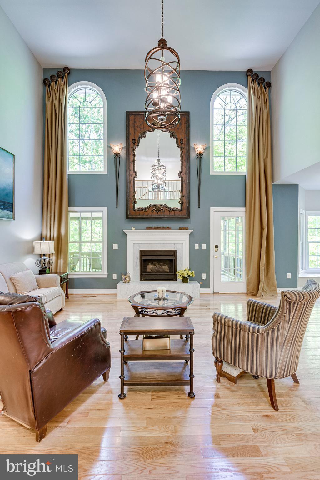 7802 Creekside View Lane Springfield, VA 22153 - Photo 32 of 107 a living room with furniture and a fireplace