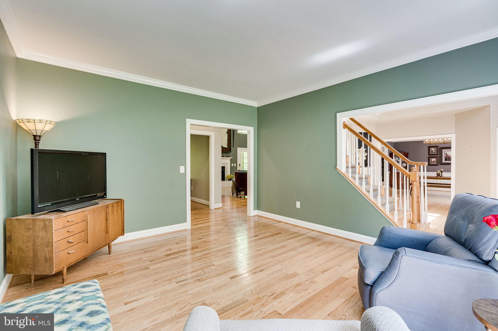 7802 Creekside View Lane Springfield, VA 22153 - Photo 35 of 107 a living room with furniture and a flat screen tv