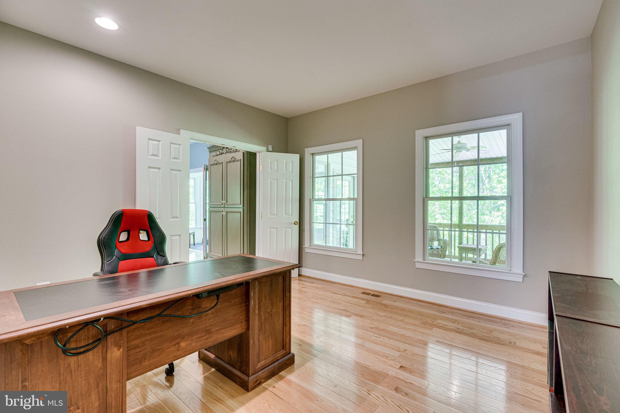 7802 Creekside View Lane Springfield, VA 22153 - Photo 36 of 107 a view of a workspace with furniture and a window