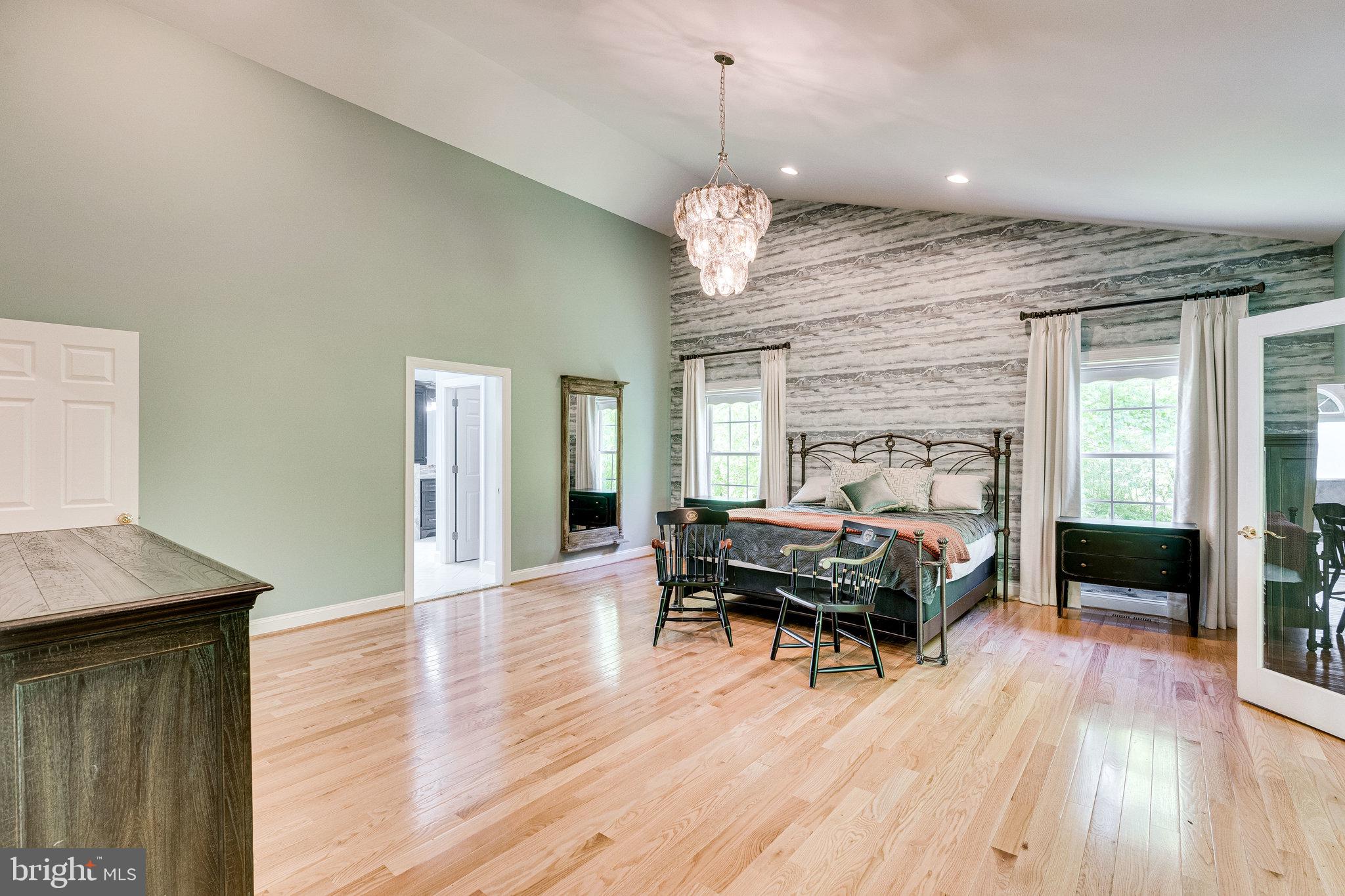 7802 Creekside View Lane Springfield, VA 22153 - Photo 40 of 107 a living room with furniture wooden floor and a fireplace