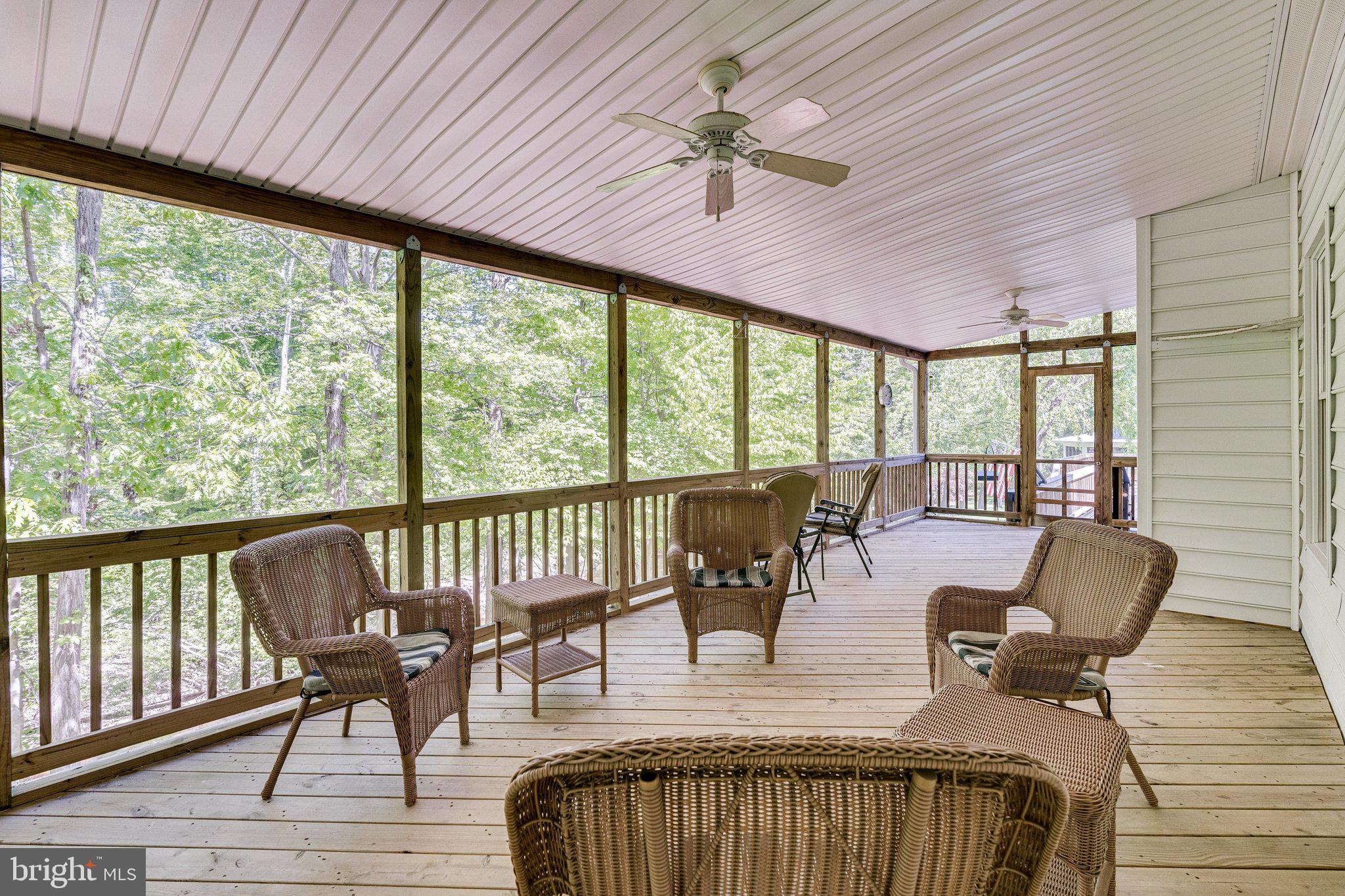 7802 Creekside View Lane Springfield, VA 22153 - Photo 58 of 107 a view of a dining room with furniture window and wooden floor