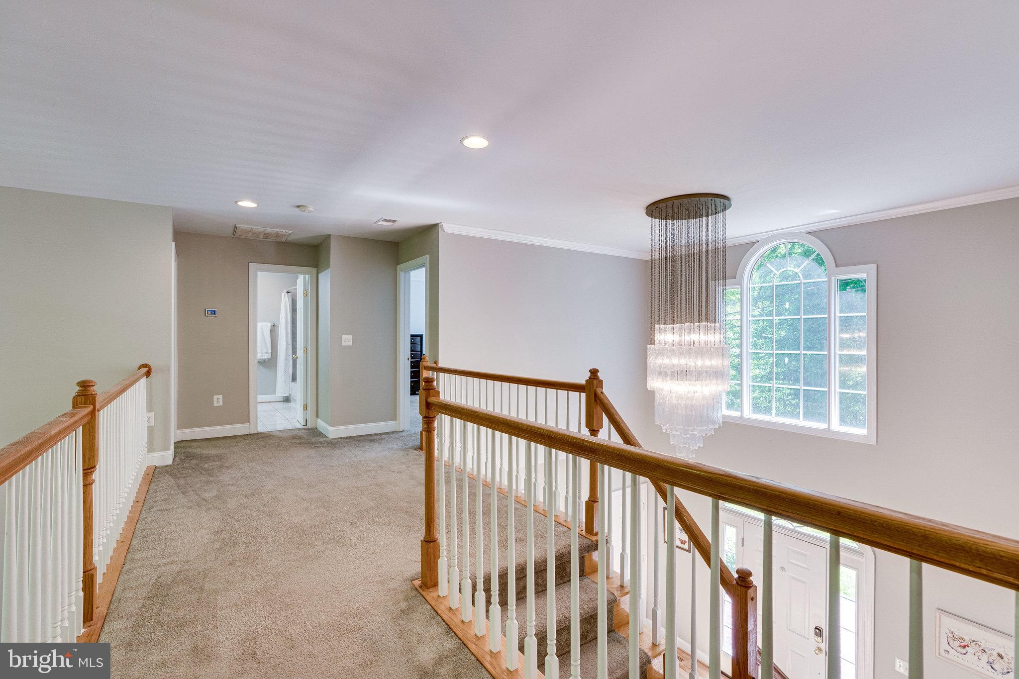 7802 Creekside View Lane Springfield, VA 22153 - Photo 64 of 107 a view of a hallway with windows
