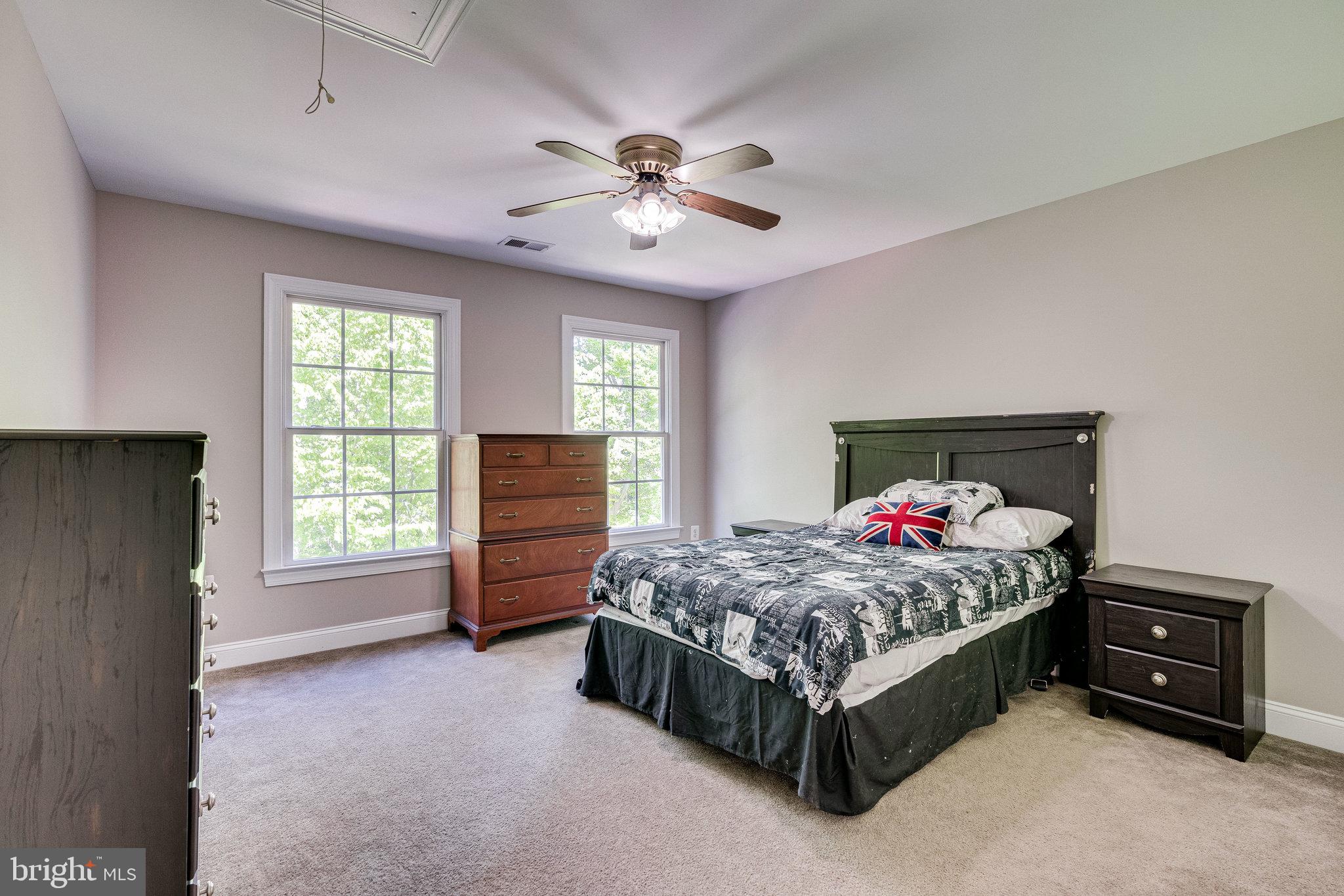 7802 Creekside View Lane Springfield, VA 22153 - Photo 67 of 107 a bedroom with a bed and a tv