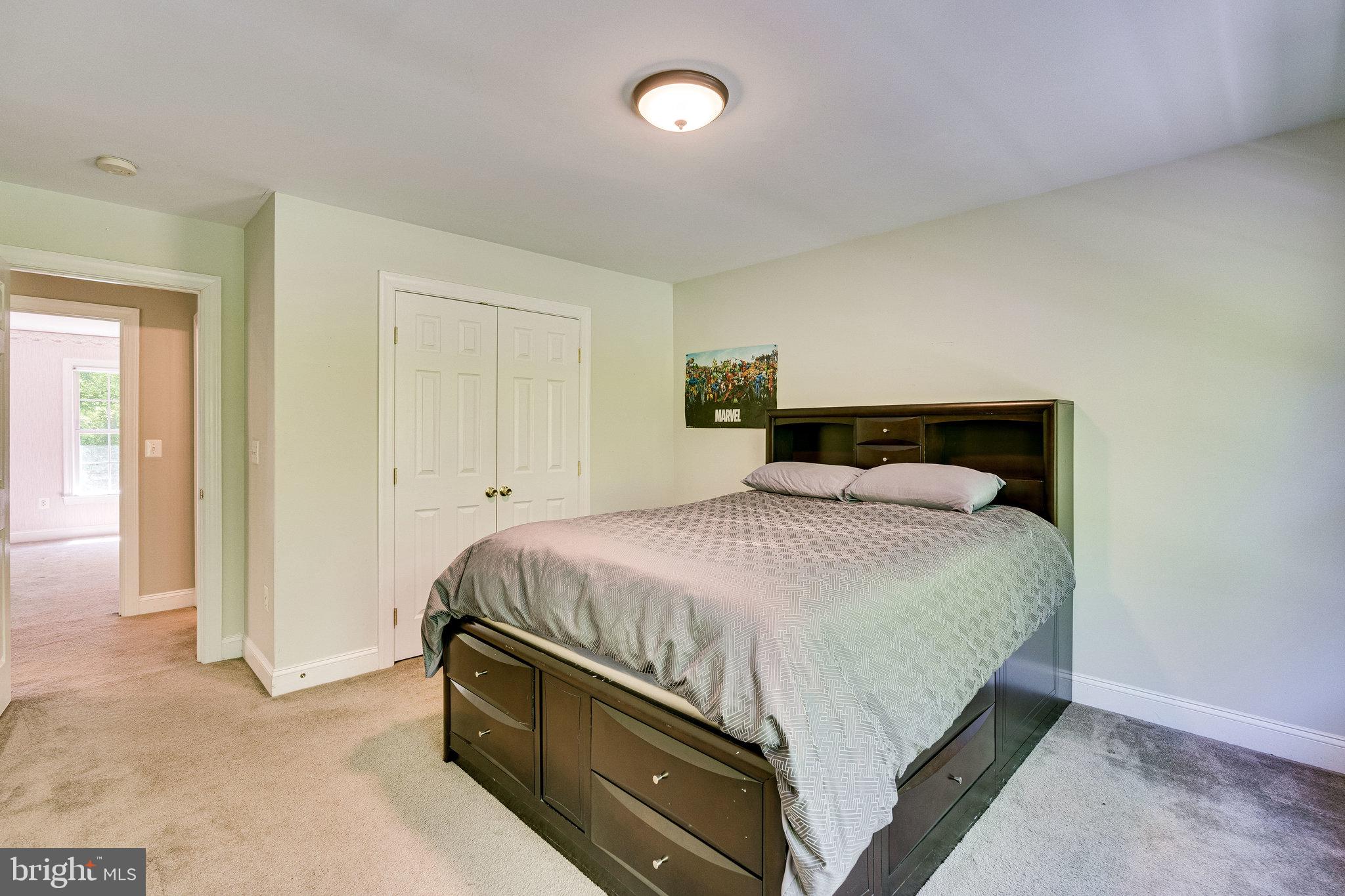 7802 Creekside View Lane Springfield, VA 22153 - Photo 73 of 107 a bedroom with a bed and a night stand