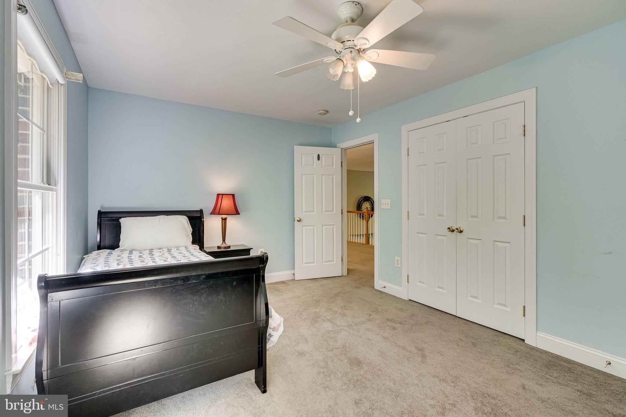 7802 Creekside View Lane Springfield, VA 22153 - Photo 79 of 107 a living room with a furniture and a ceiling fan