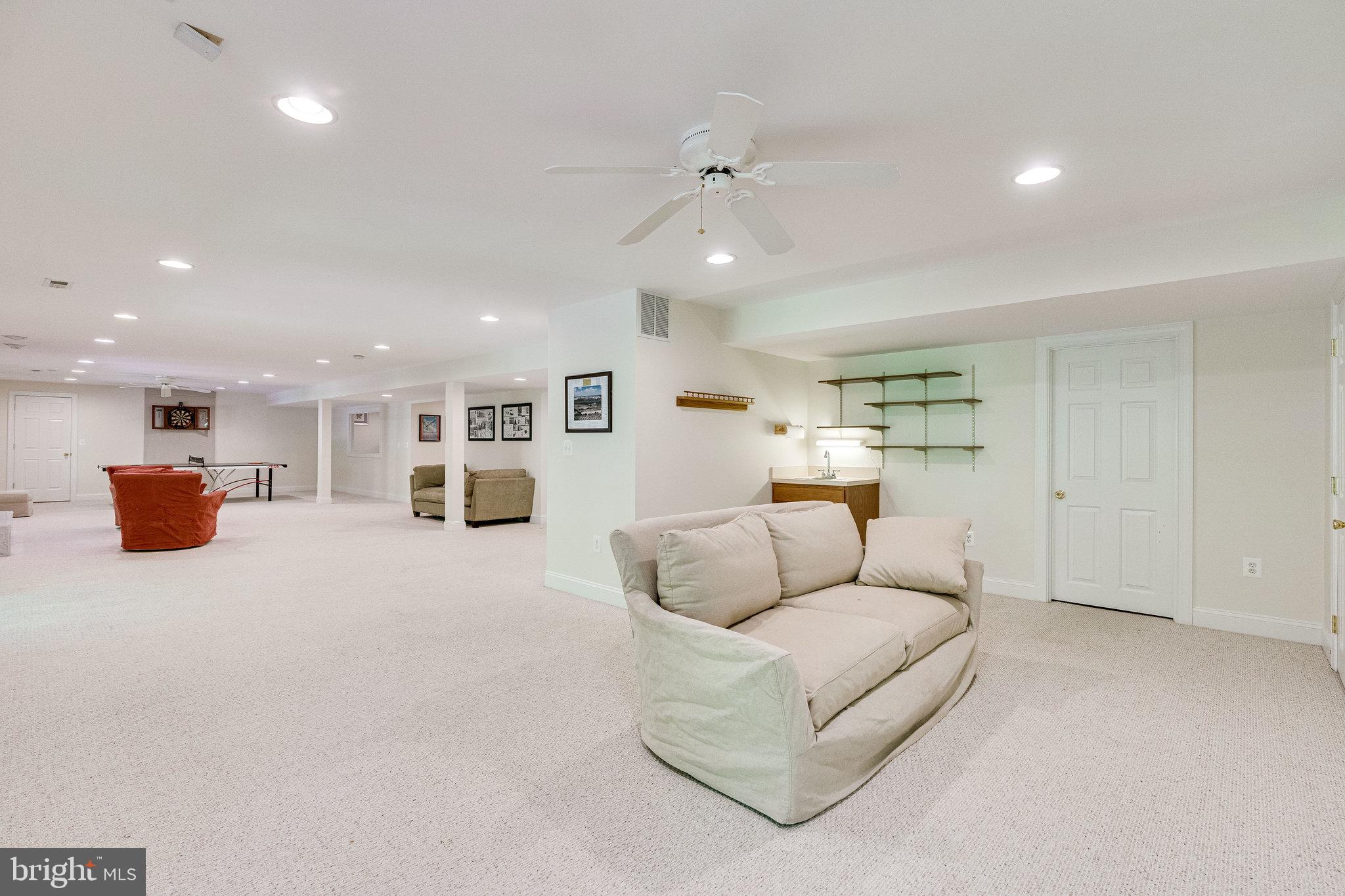 7802 Creekside View Lane Springfield, VA 22153 - Photo 82 of 107 a living room with furniture and kitchen view