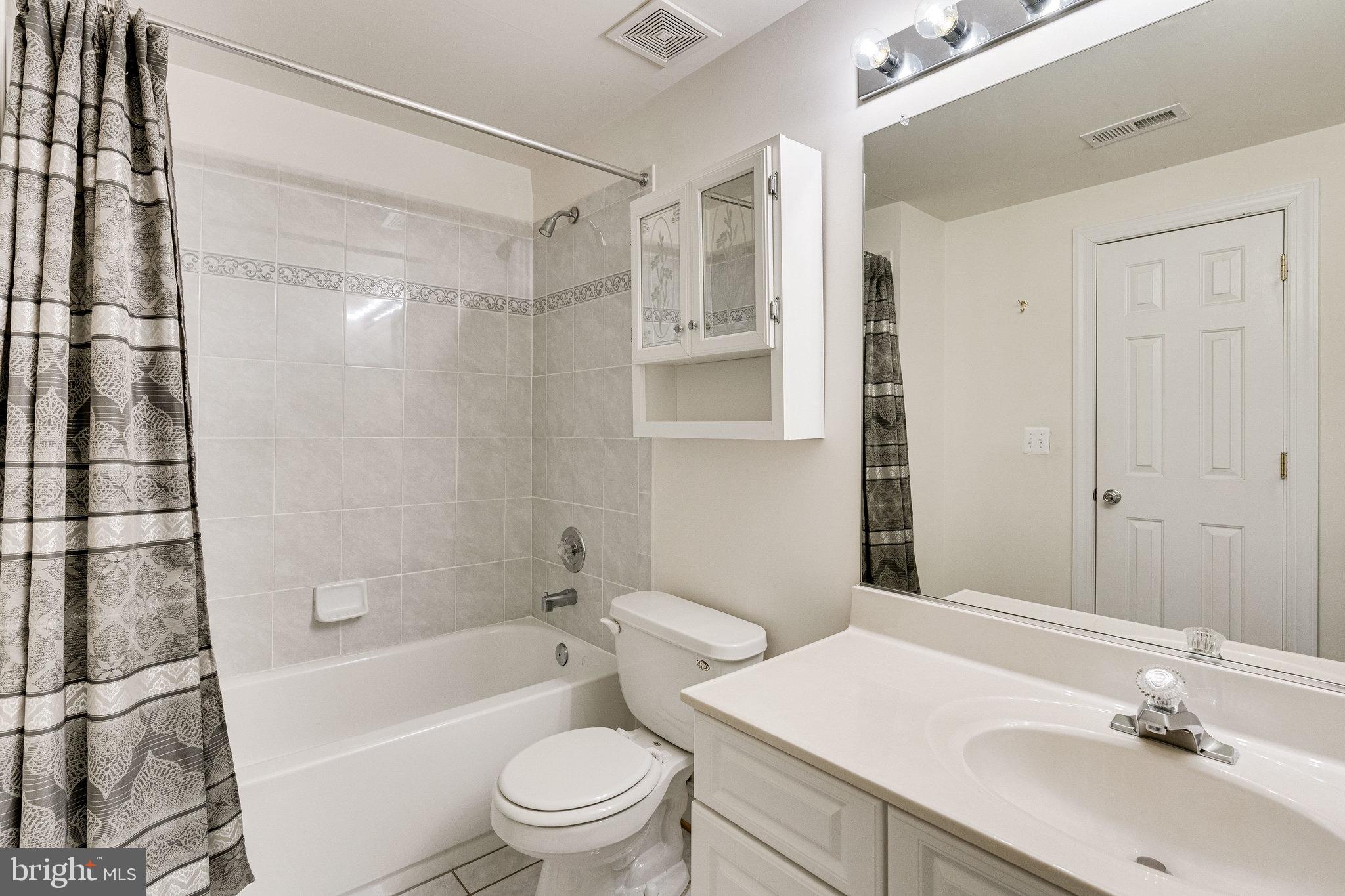 7802 Creekside View Lane Springfield, VA 22153 - Photo 90 of 107 a bathroom with a sink toilet tub and shower