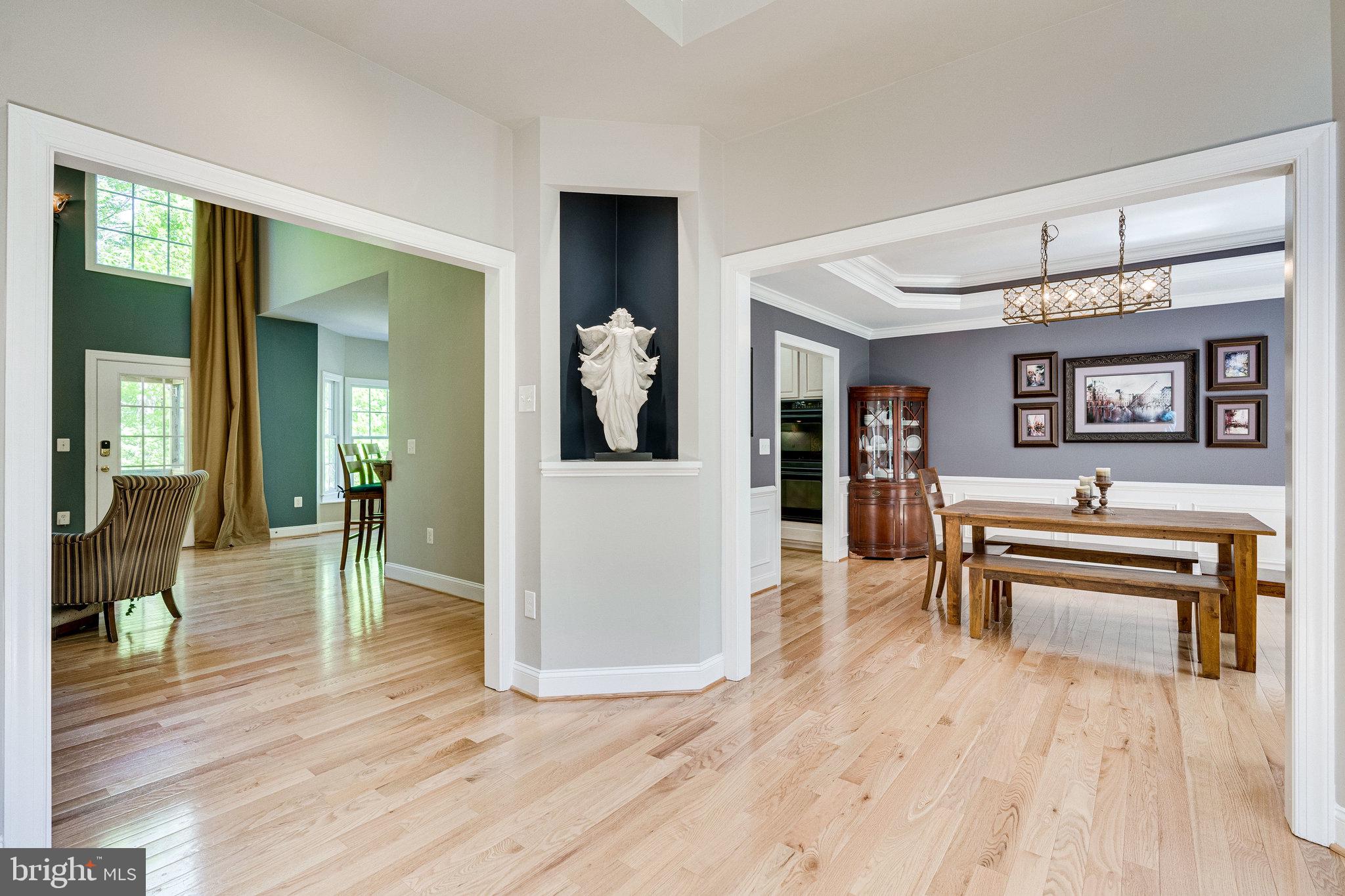7802 Creekside View Lane Springfield, VA 22153 - Photo 9 of 107 a living room with furniture and a wooden floor
