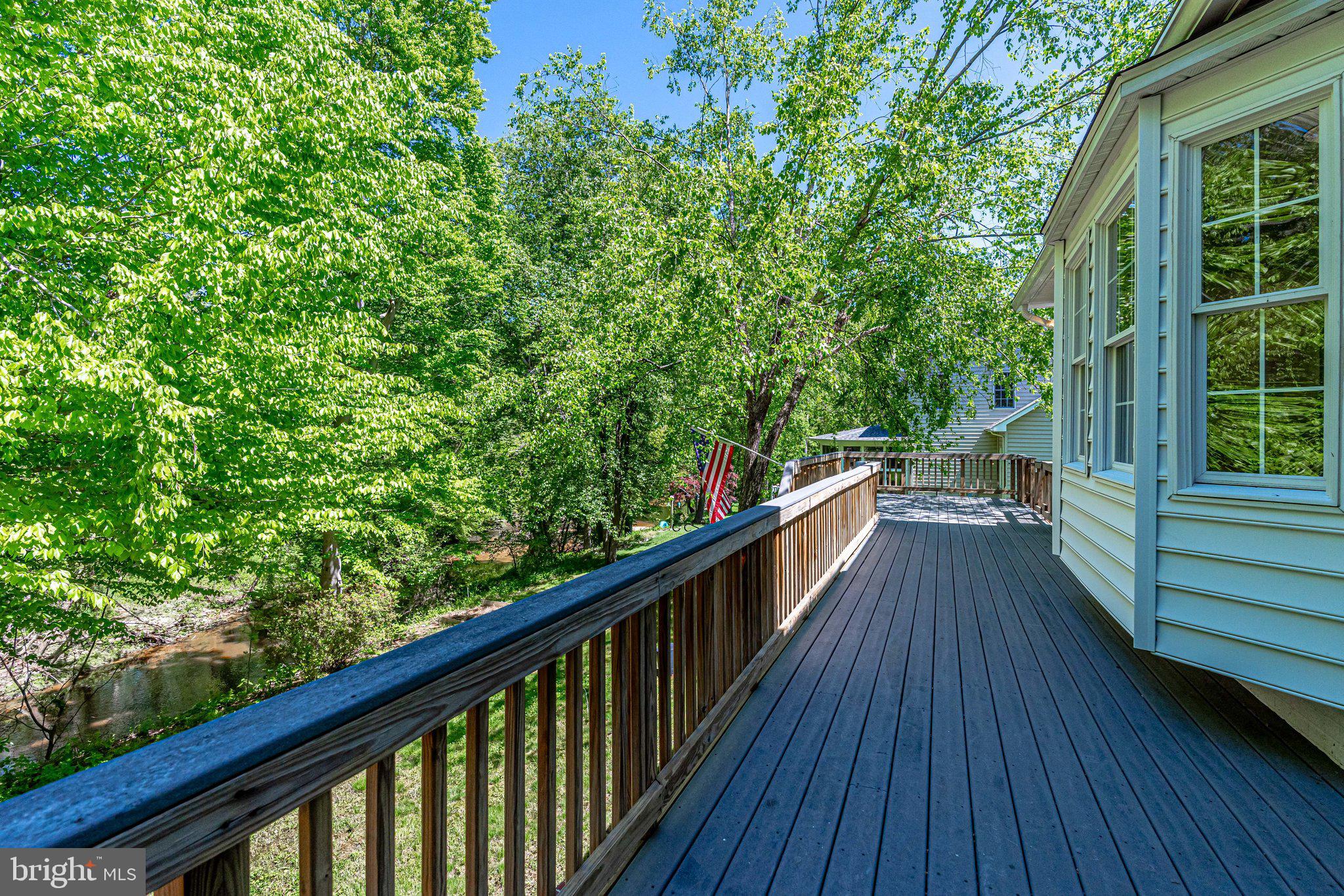 7802 Creekside View Lane Springfield, VA 22153 - Photo 91 of 107 a view of balcony with wooden floor and fence