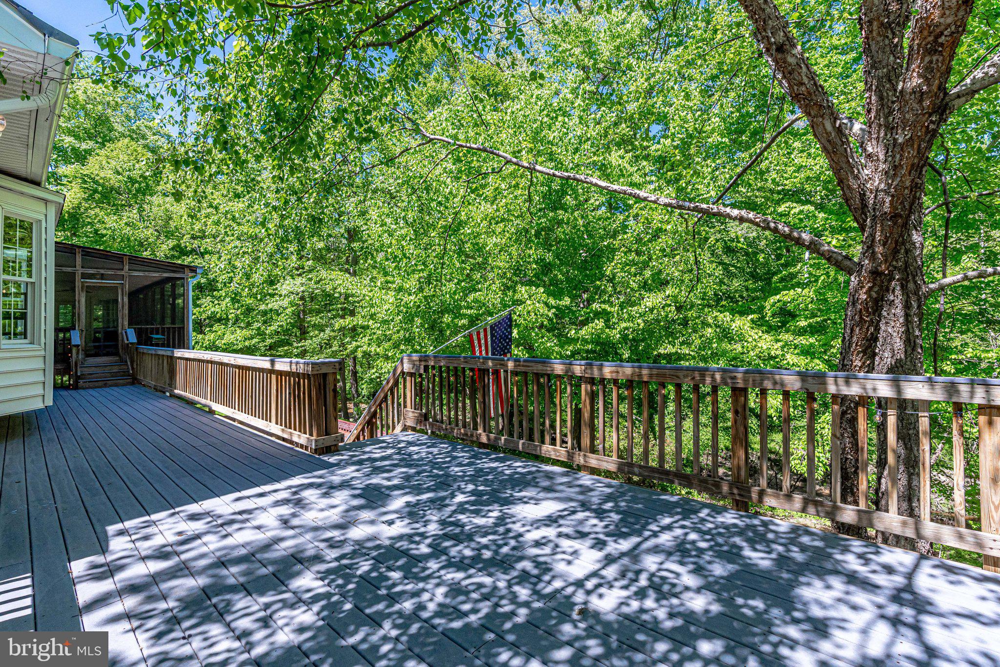 7802 Creekside View Lane Springfield, VA 22153 - Photo 92 of 107 a view of balcony with wooden floor and fence