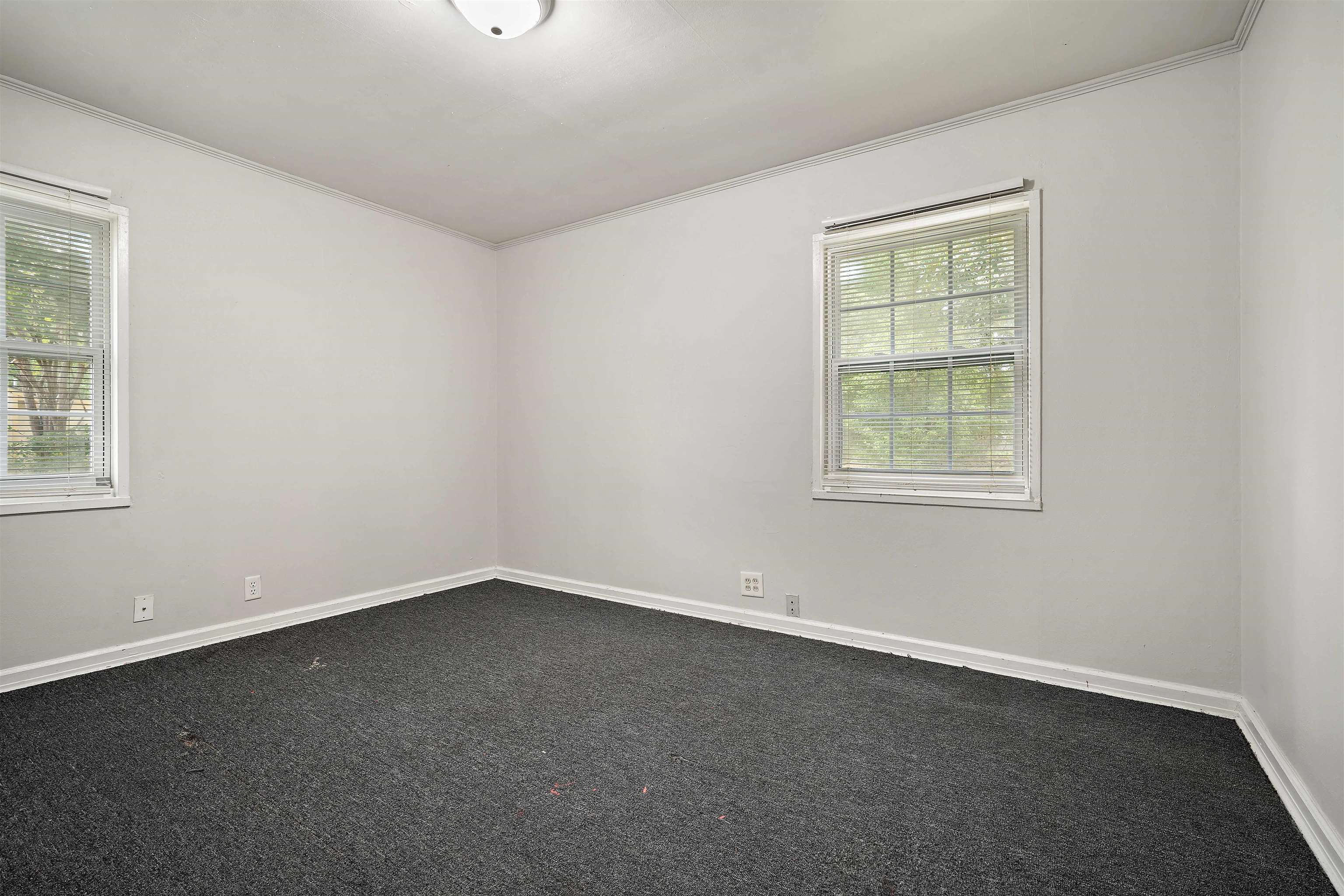 3014 Farcott Street Mobile, AL 36606 - Photo 20 of 26 Spare room featuring dark colored carpet and ornamental molding