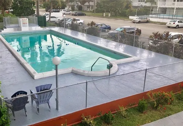 a view of swimming pool from a balcony