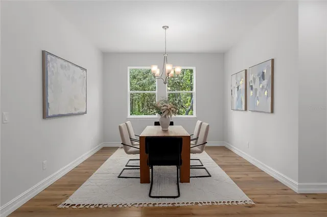 a dining room with furniture and window