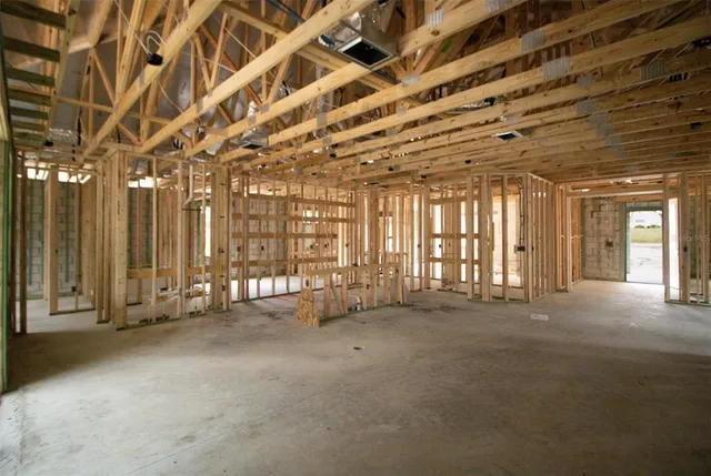 a view of an empty room with windows