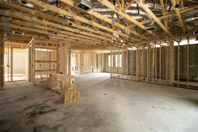 a view of an empty room with wooden walls