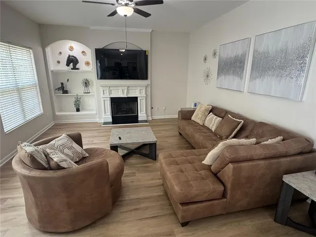 a living room with furniture and a fireplace