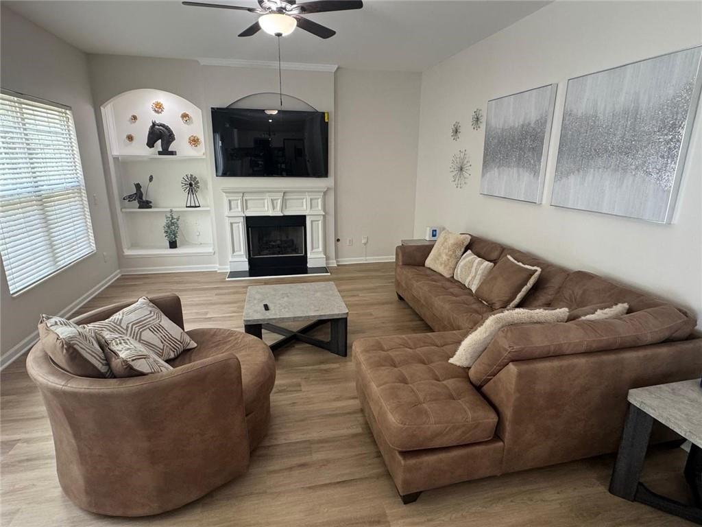 3926 Yosemite Park Lane Snellville, GA 30039 - Photo 7 of 10 a living room with furniture and a fireplace