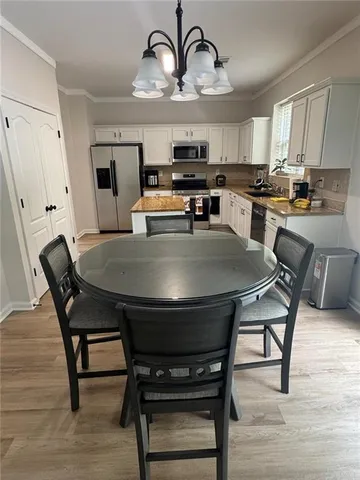 a view of a dining room with furniture
