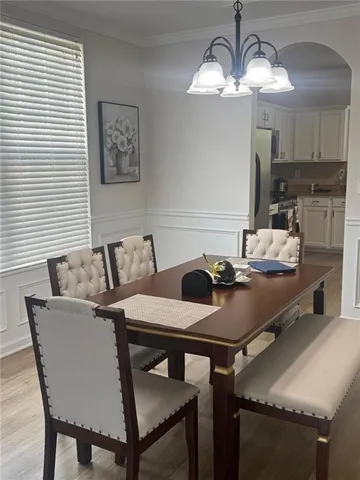 a kitchen with a table and chairs in it