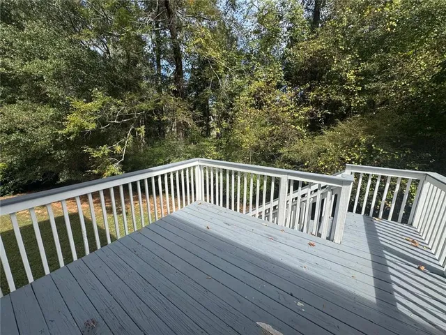 a balcony with wooden floor