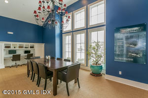 77 Havemeyer Lane, Unit 48 Stamford, CT 06902 - Photo 13 of 16 a view of a dining room with furniture and chandelier