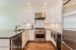 77 Havemeyer Lane, Unit 48 Stamford, CT 06902 - Photo 3 of 16 a kitchen with a stove microwave and sink