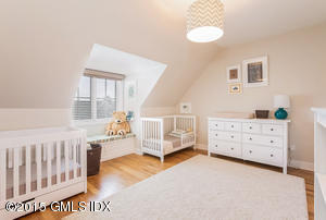 77 Havemeyer Lane, Unit 48 Stamford, CT 06902 - Photo 7 of 16 a bedroom with furniture and a window