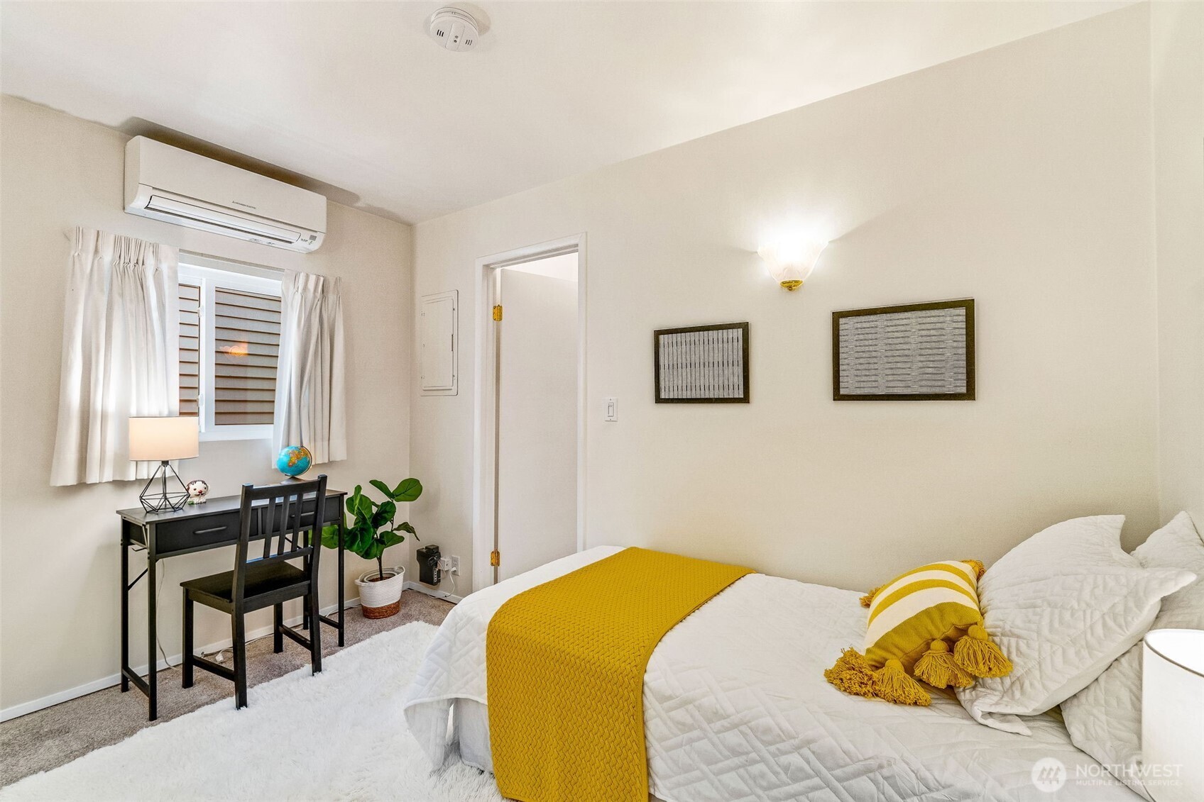 2358 Northwest 73rd Street Seattle, WA 98117 - Photo 13 of 18 a bedroom with a bed and chair