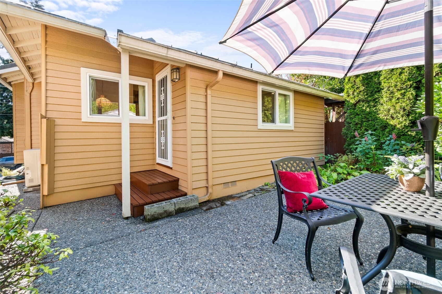 2358 Northwest 73rd Street Seattle, WA 98117 - Photo 16 of 18 a view of a house with backyard and sitting area
