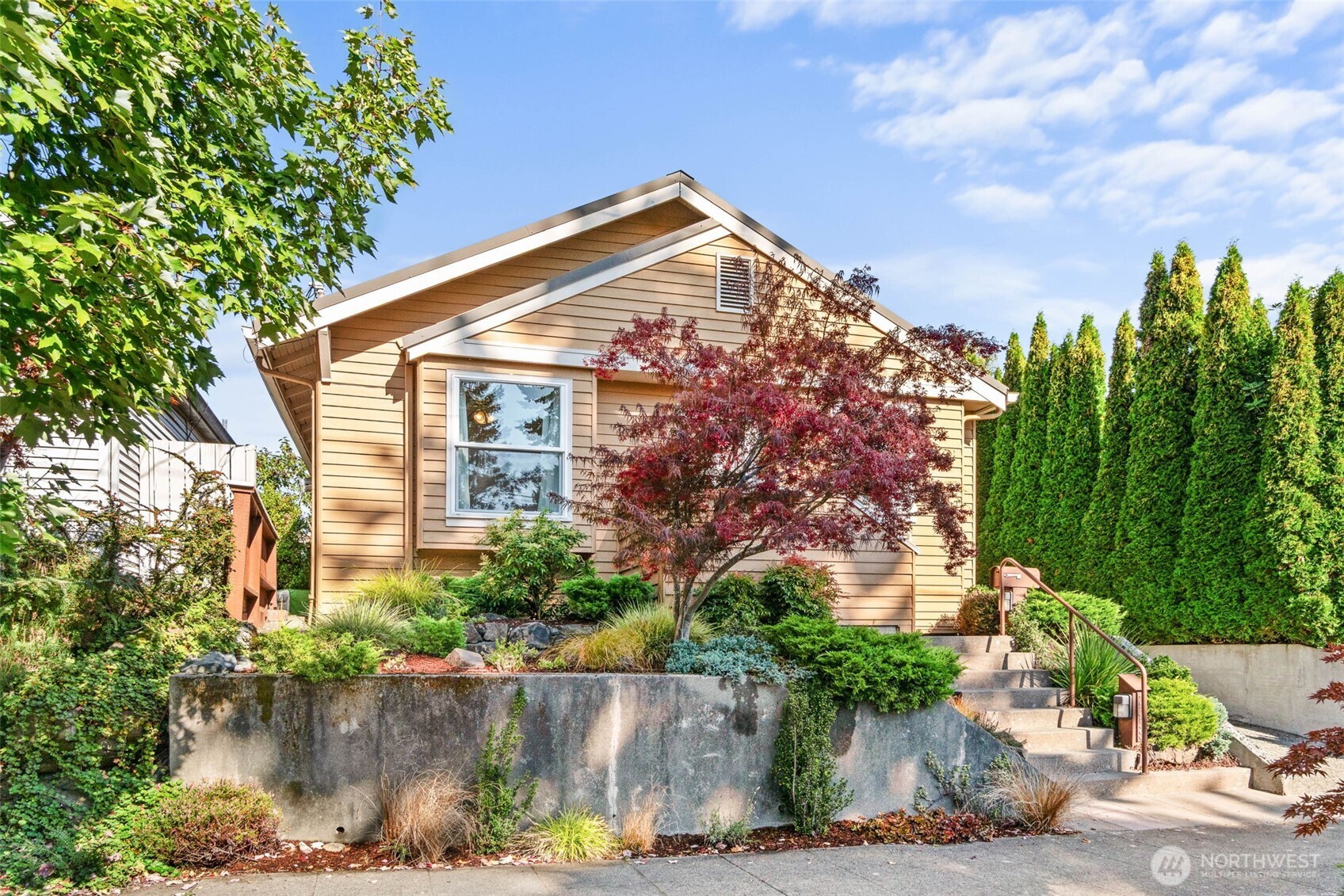 2358 Northwest 73rd Street Seattle, WA 98117 - Photo 18 of 18 a view of a house with a yard and plants