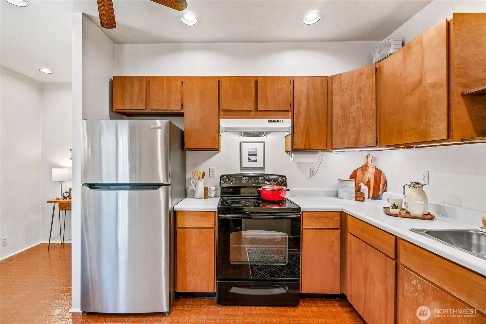 2358 Northwest 73rd Street Seattle, WA 98117 - Photo 7 of 18 a kitchen with stainless steel appliances a refrigerator and a sink