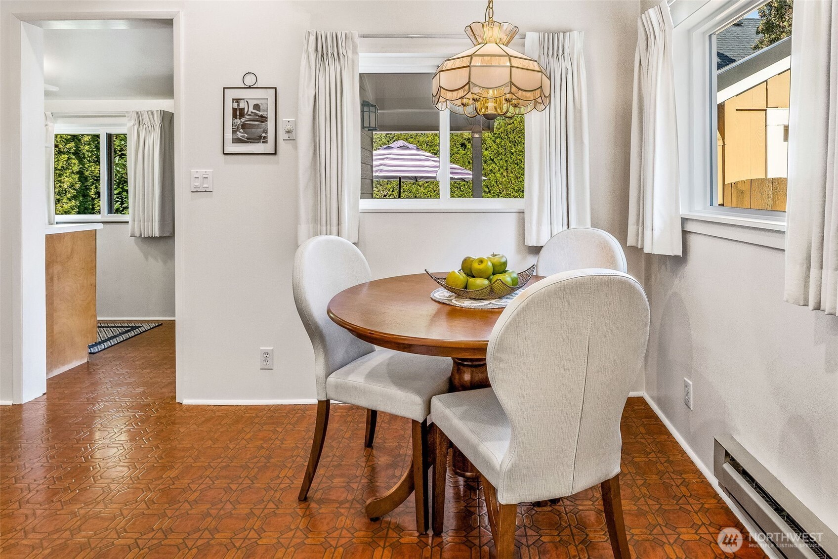 2358 Northwest 73rd Street Seattle, WA 98117 - Photo 10 of 18 a view of a dining room with furniture and wooden floor