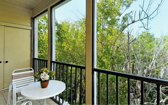 a view of a house with a backyard porch and sitting area