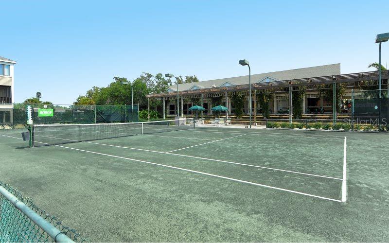 619 Cedars Court Longboat Key, FL 34228 - Photo 26 of 95 a view of a tennis ground with large trees