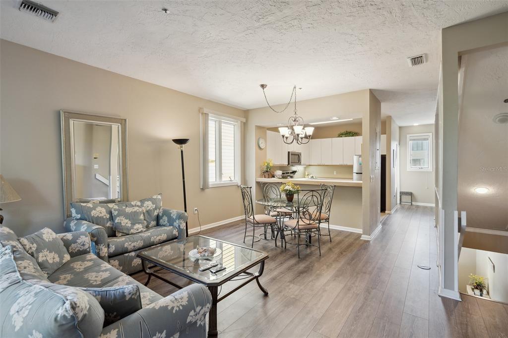 619 Cedars Court Longboat Key, FL 34228 - Photo 37 of 95 a living room with furniture and a wooden floor