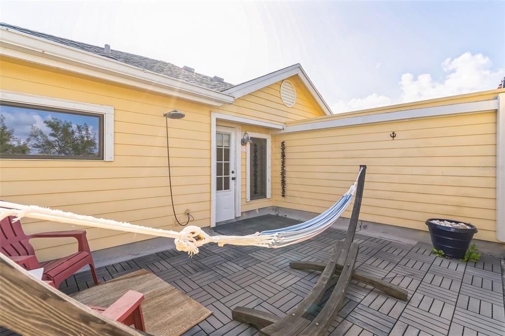 619 Cedars Court Longboat Key, FL 34228 - Photo 49 of 95 a view of a two chairs in the patio