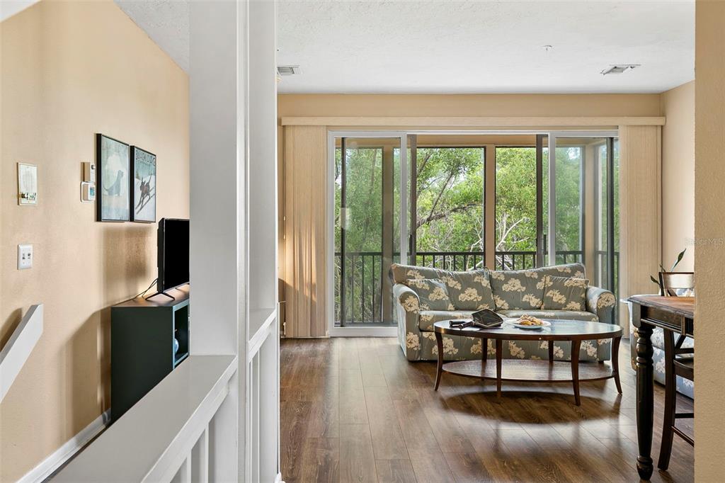 619 Cedars Court Longboat Key, FL 34228 - Photo 55 of 95 a living room with furniture and a flat screen tv