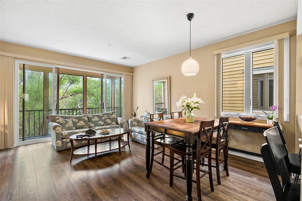 619 Cedars Court Longboat Key, FL 34228 - Photo 56 of 95 a dining room with furniture window and wooden floor