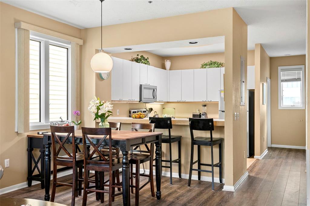 619 Cedars Court Longboat Key, FL 34228 - Photo 59 of 95 a view of a dining room with furniture and wooden floor