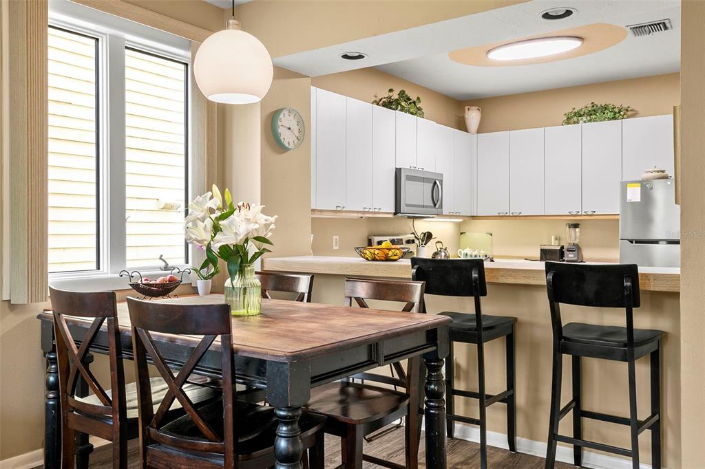 619 Cedars Court Longboat Key, FL 34228 - Photo 61 of 95 a view of kitchen with cabinets table and chairs