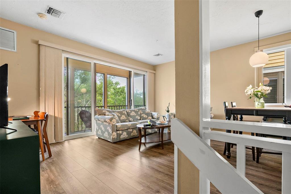 619 Cedars Court Longboat Key, FL 34228 - Photo 63 of 95 a living room with furniture and large windows
