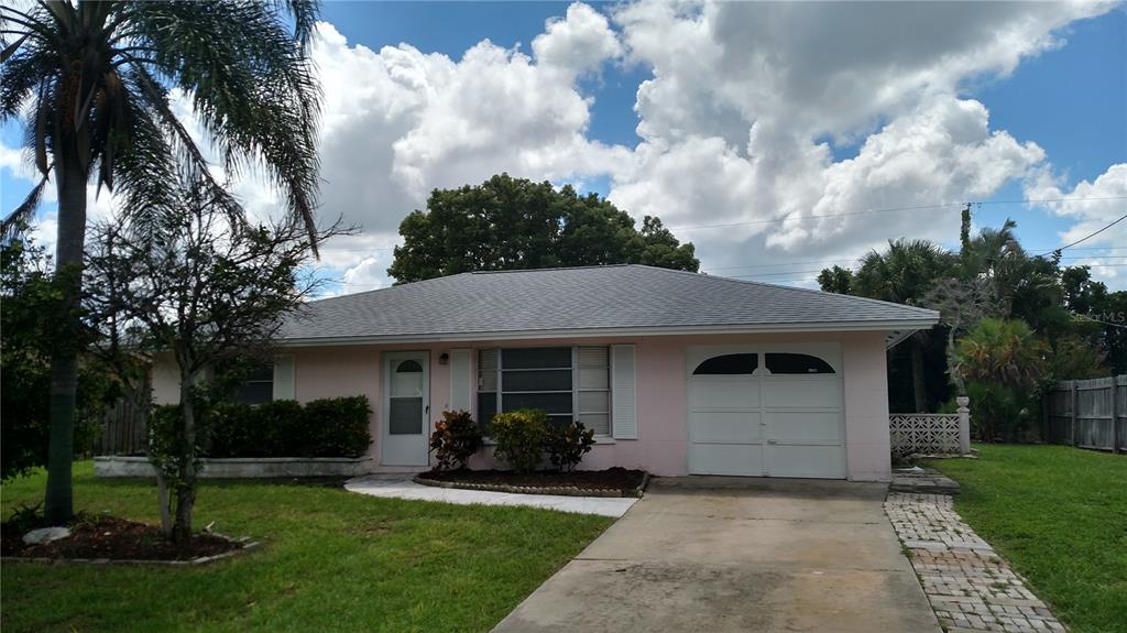 536 Center Road Venice, FL 34285 - Photo 1 of 1 a front view of a house with a garden