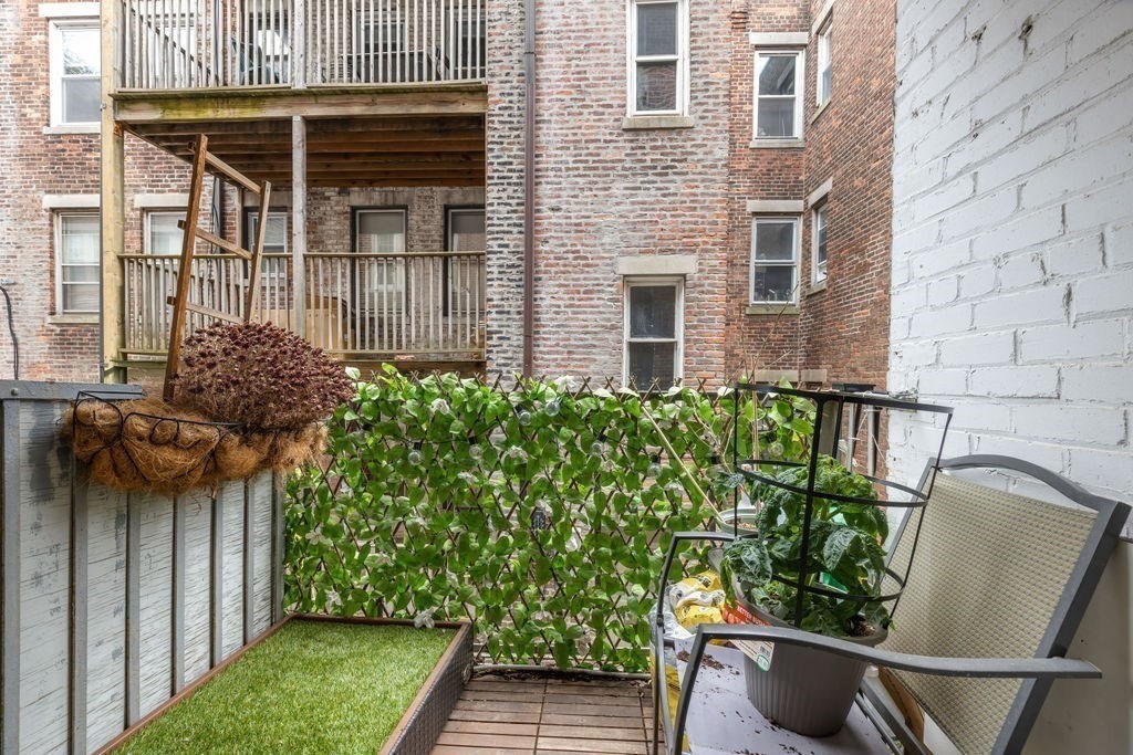 21 Sutherland Road, Unit 6 Boston, MA 02135 - Photo 11 of 20 a backyard of a house with lots of green space