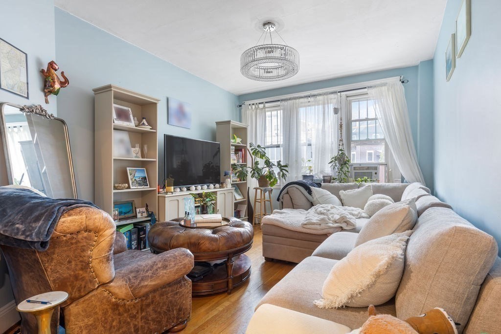21 Sutherland Road, Unit 6 Boston, MA 02135 - Photo 12 of 20 a living room with furniture ceiling fan and a window