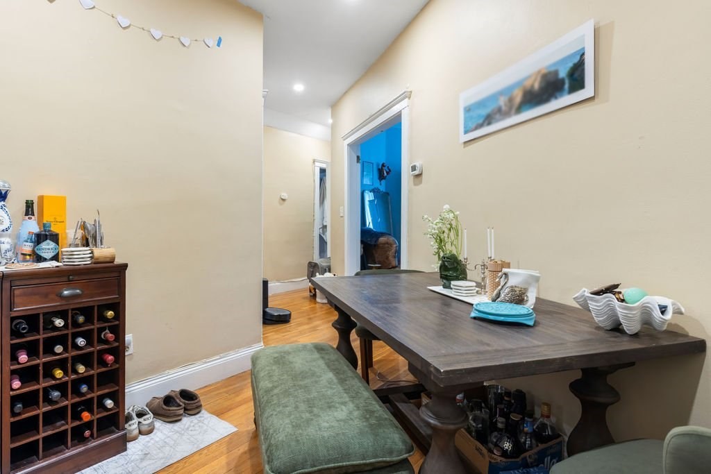 21 Sutherland Road, Unit 6 Boston, MA 02135 - Photo 14 of 20 a dining room with a table and chairs in it
