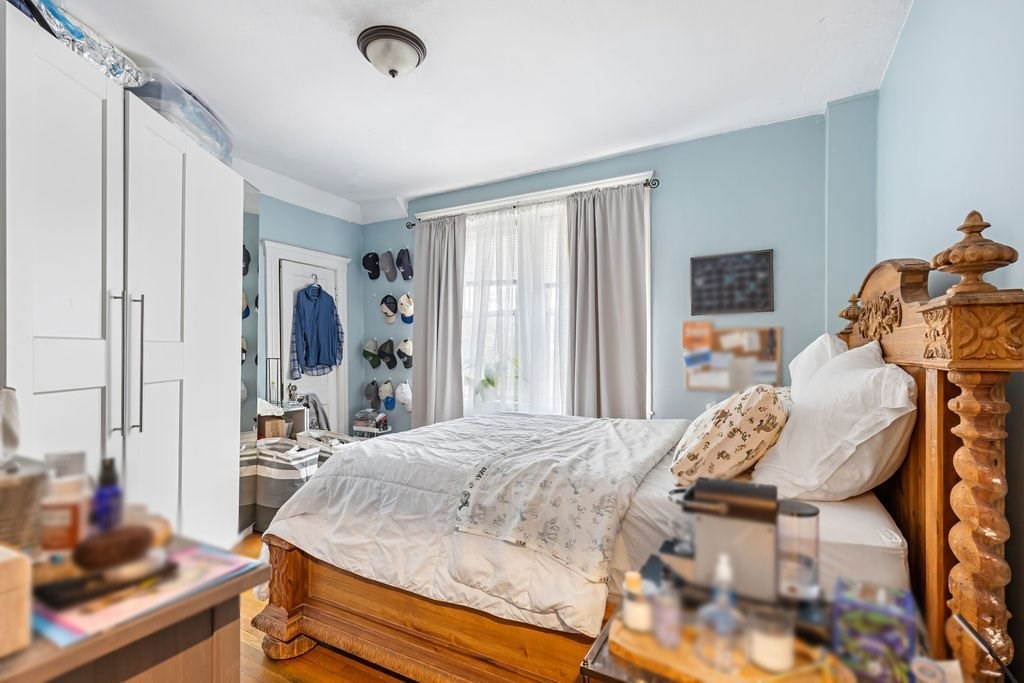 21 Sutherland Road, Unit 6 Boston, MA 02135 - Photo 16 of 20 a bedroom with a bed and large windows
